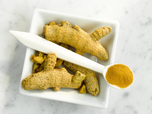 Turmeric roots and turmeric powder, close-up