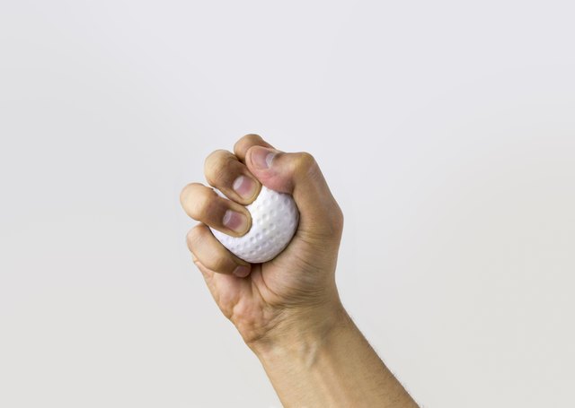 hand squeezing stress ball