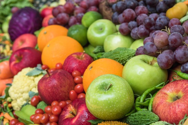 Selective focus and close-up green apple with group fruits