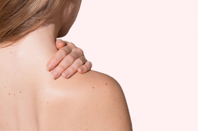 Girl holding neck/shoulder