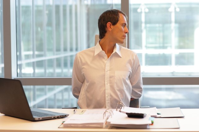 white collar worker male stretching arms