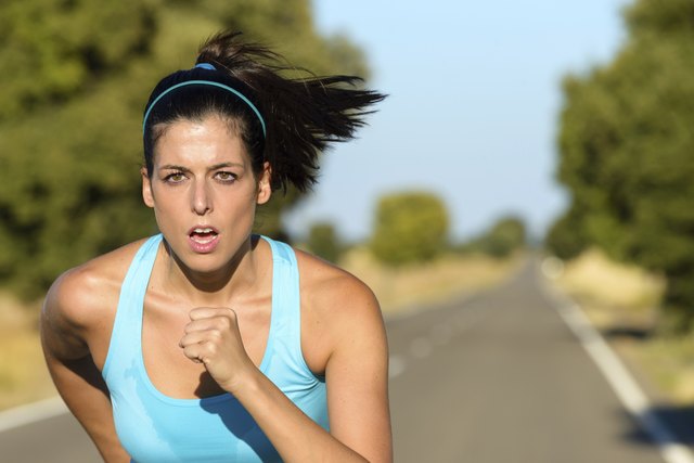 Sport woman running in road