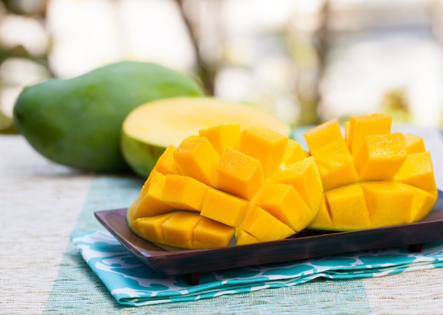 Fresh mango organic product on a tropical outdoor background