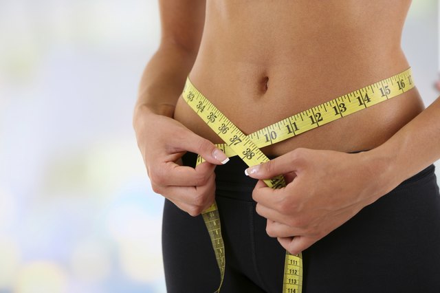 Slim girl with centimeter on bright background