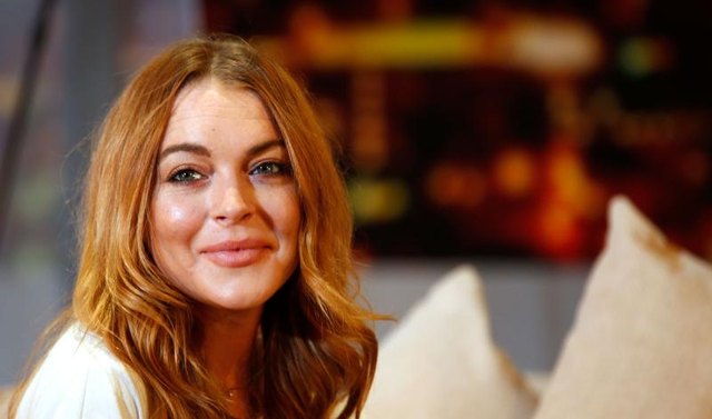 LONDON, ENGLAND - SEPTEMBER 30: Lindsay Lohan performs during a photocall for “Speed The Plow” at Playhouse Theatre on September 30, 2014, in London. (Photo by Tim P. Whitby/Getty Images)