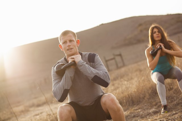 Couple working out with weights
