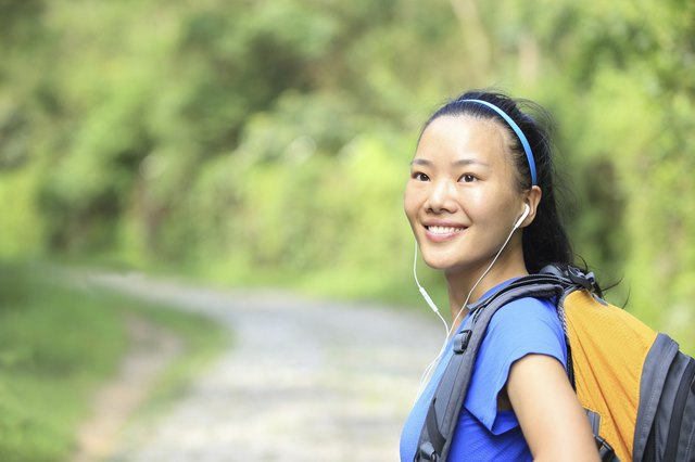 hiking woman on forest trail