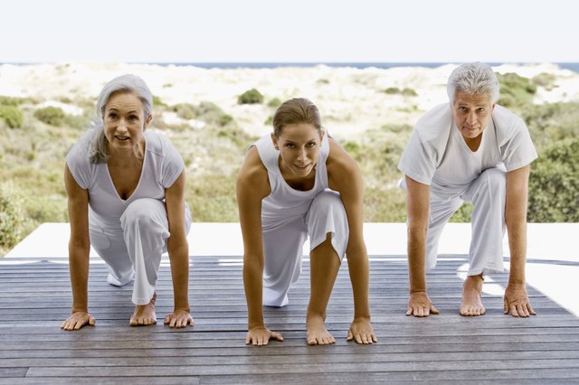 People exercising by beach