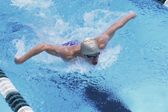 Young man swimming in a swimming pool