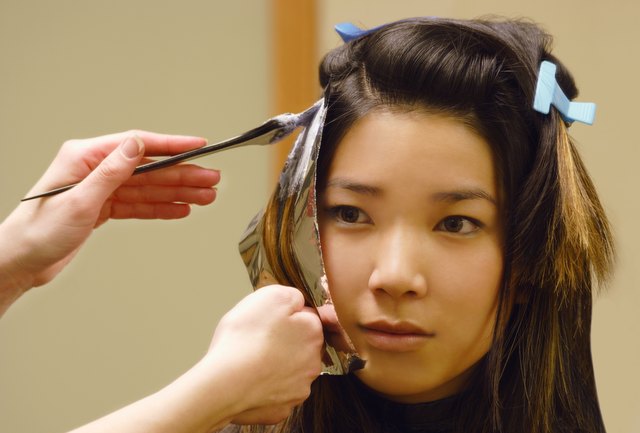 Closeup of woman getting hair foils