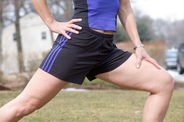 Woman stretching outdoors before exercise
