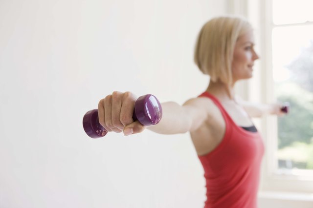 Woman exercising with dumbbells