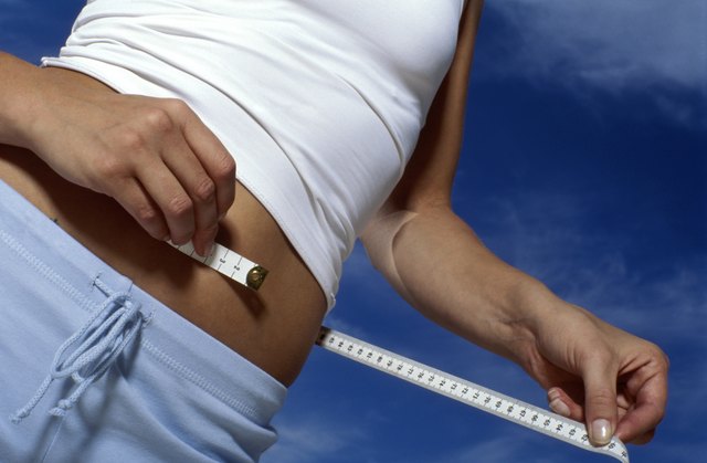 Woman measuring waist