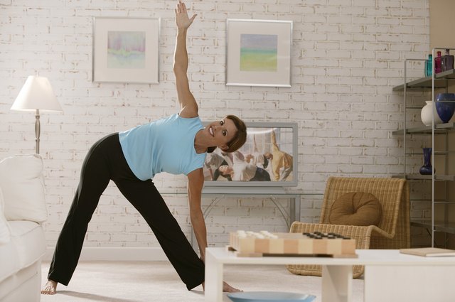 Woman exercising in living room