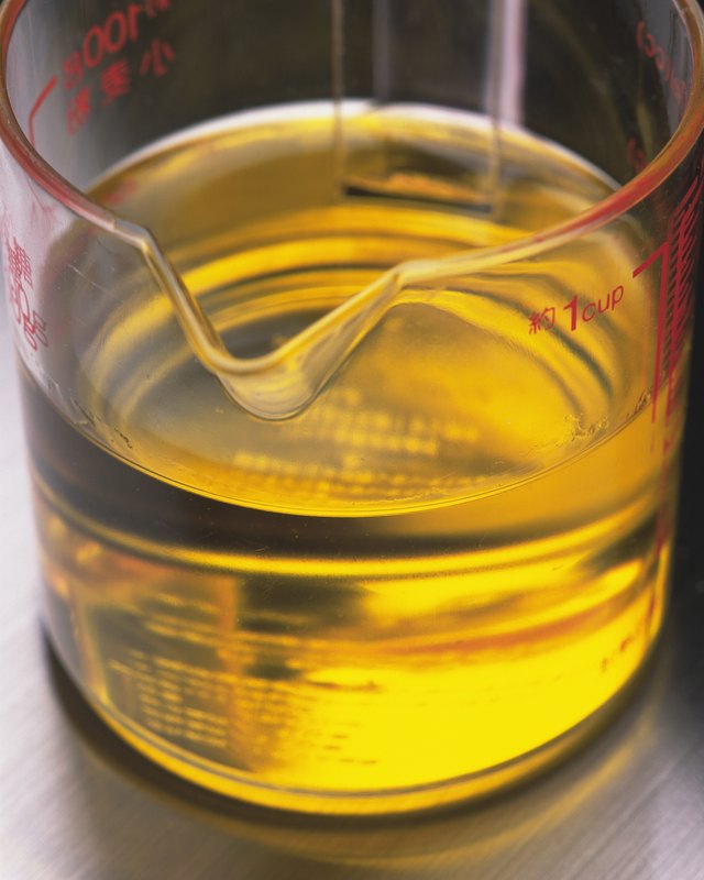 Closed Up Image of Some Yellow Oil in a Measuring Cup, High Angle View, Differential Focus
