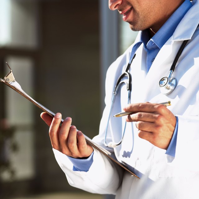 Doctor checking chart