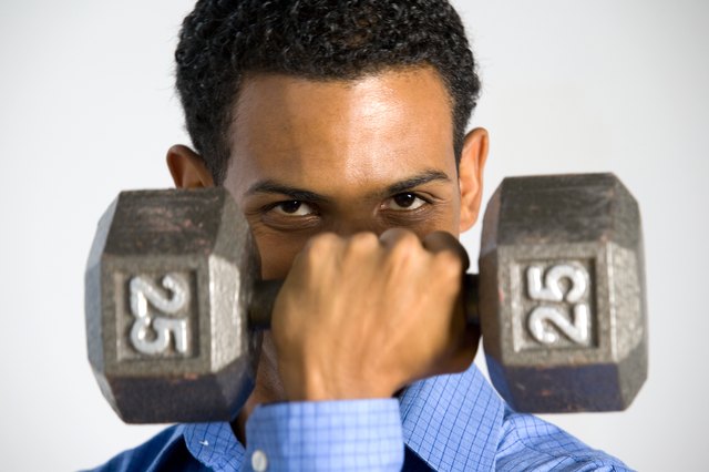 Man posing with dumbbell