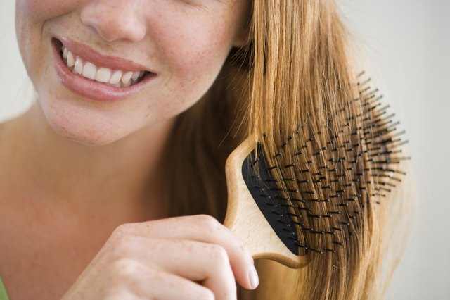 Woman combing her hair