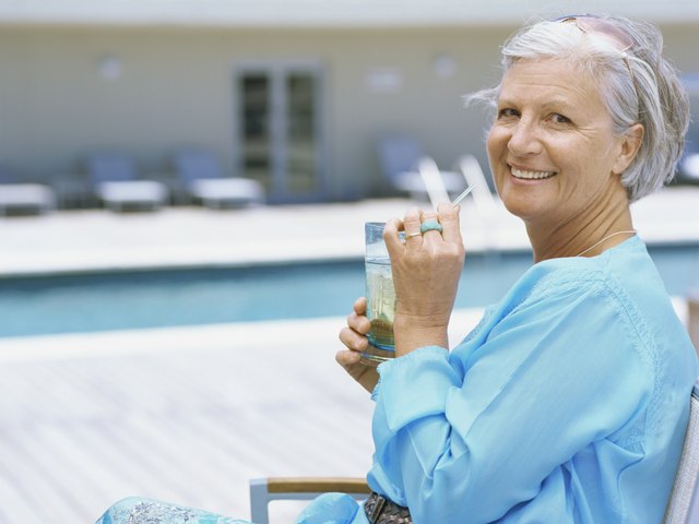 Profile of a senior woman sitting by swimming pool