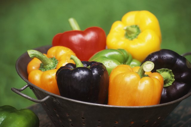 Still life of bell peppers in colander