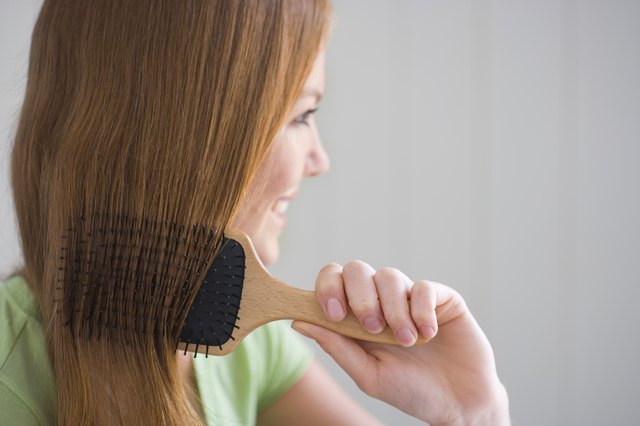 Woman combing her hair