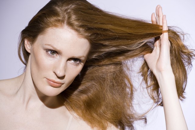 Woman with touching her hair
