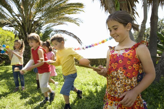Children running egg and spoon race