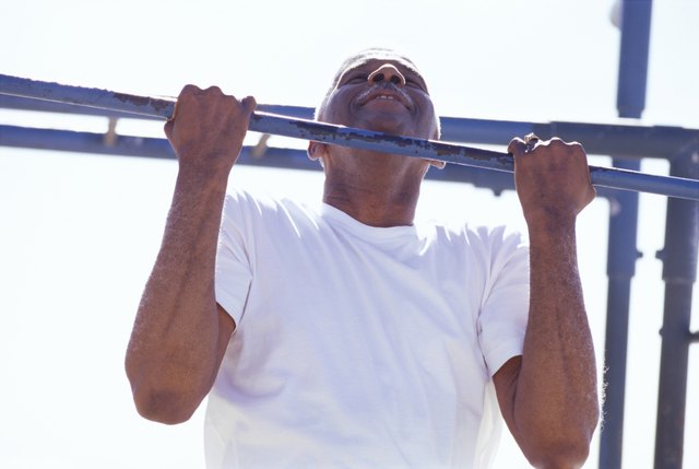 Senior man doing a chin-up