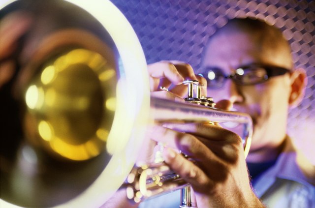 Close-up of a young man playing the trumpet