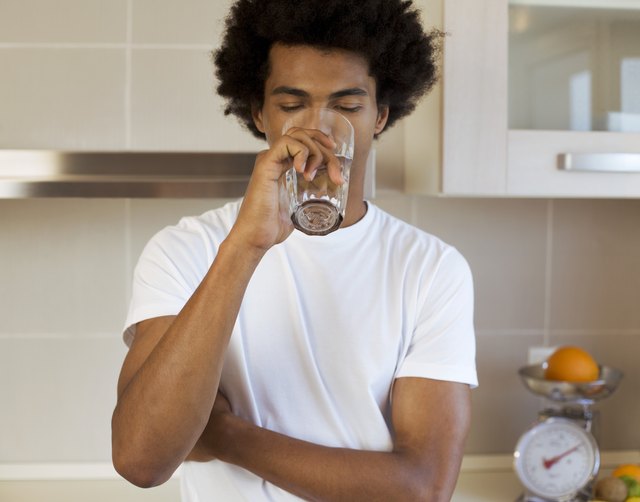 Man drinking a glass of water