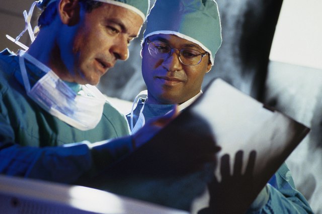Surgeons reading x-rays