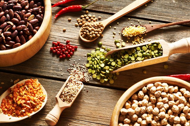 Bowls and spoons of various legumes