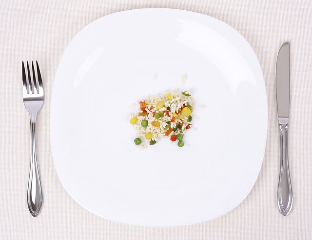 Small portion of food on a big plate