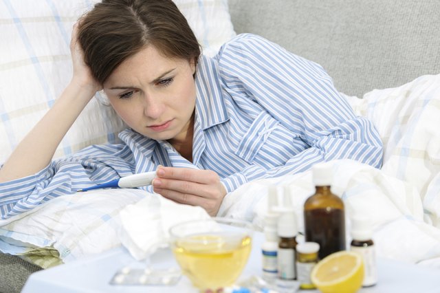 Sick woman lying in bed