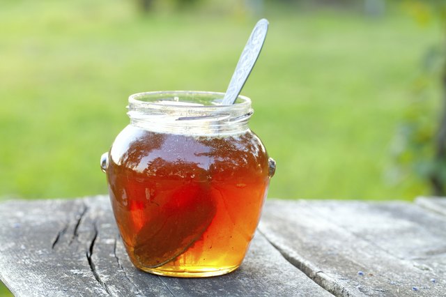 honey jar on wooden table