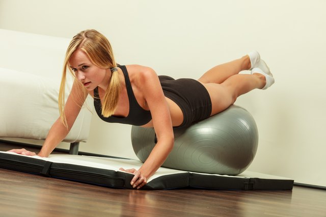 woman doing fitness exercises with fit ball