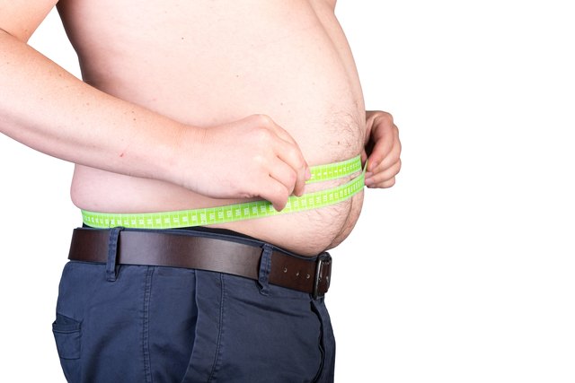 View of a the belly of a overweighted male - isolated on white background