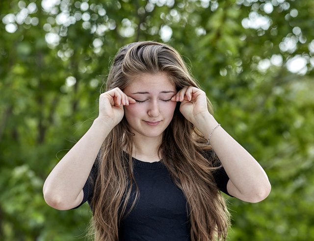 Sleepy Woman rubbing her Eyes