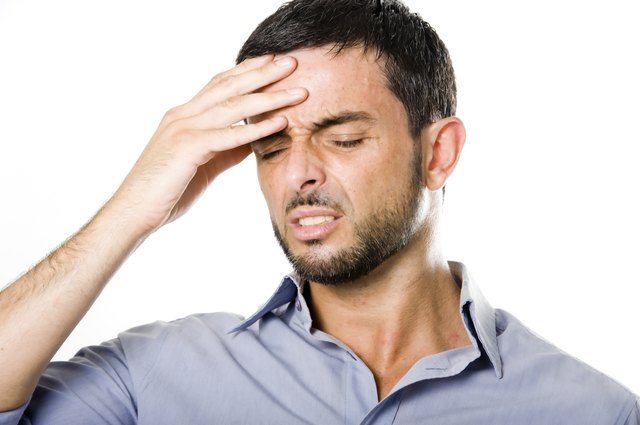 Young Man with Beard suffering Headache Isolated on White Background
