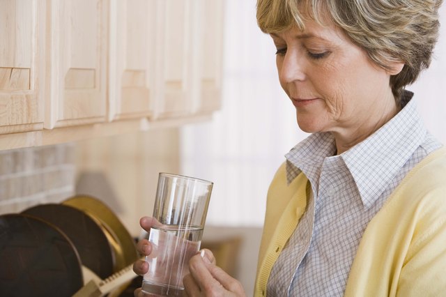 Worried woman with pill