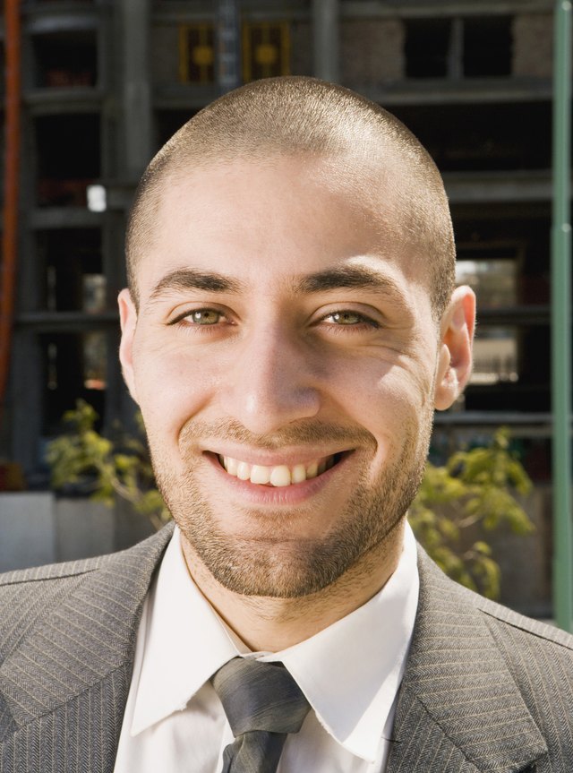 Close up of Hispanic businessman smiling