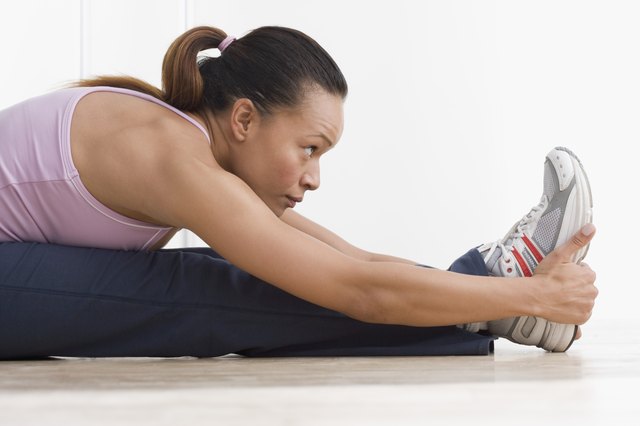 Side view of woman stretching