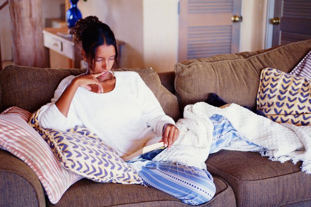 Woman reading on sofa