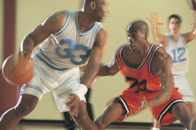 Basketball players during game action