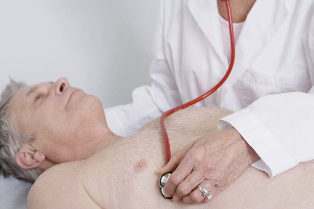 Senior medical practitioner examines man with stethoscope