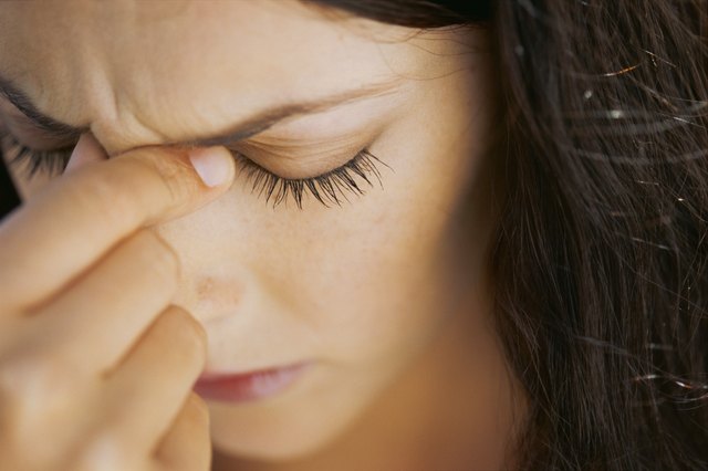 close-up of a young woman suffering from a headache