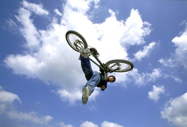 Young man performing stunt on bicycle