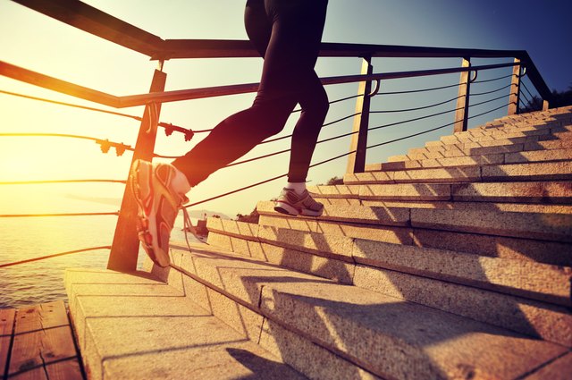 healthy lifestyle asian woman running at stairs seaside