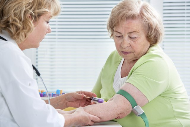 Nurse taking blood sample