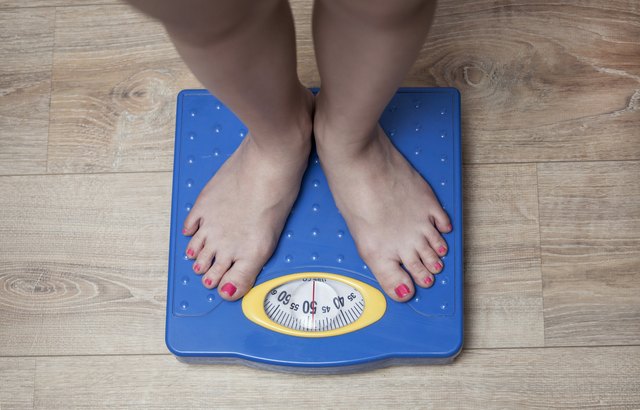 feet standing on a scale
